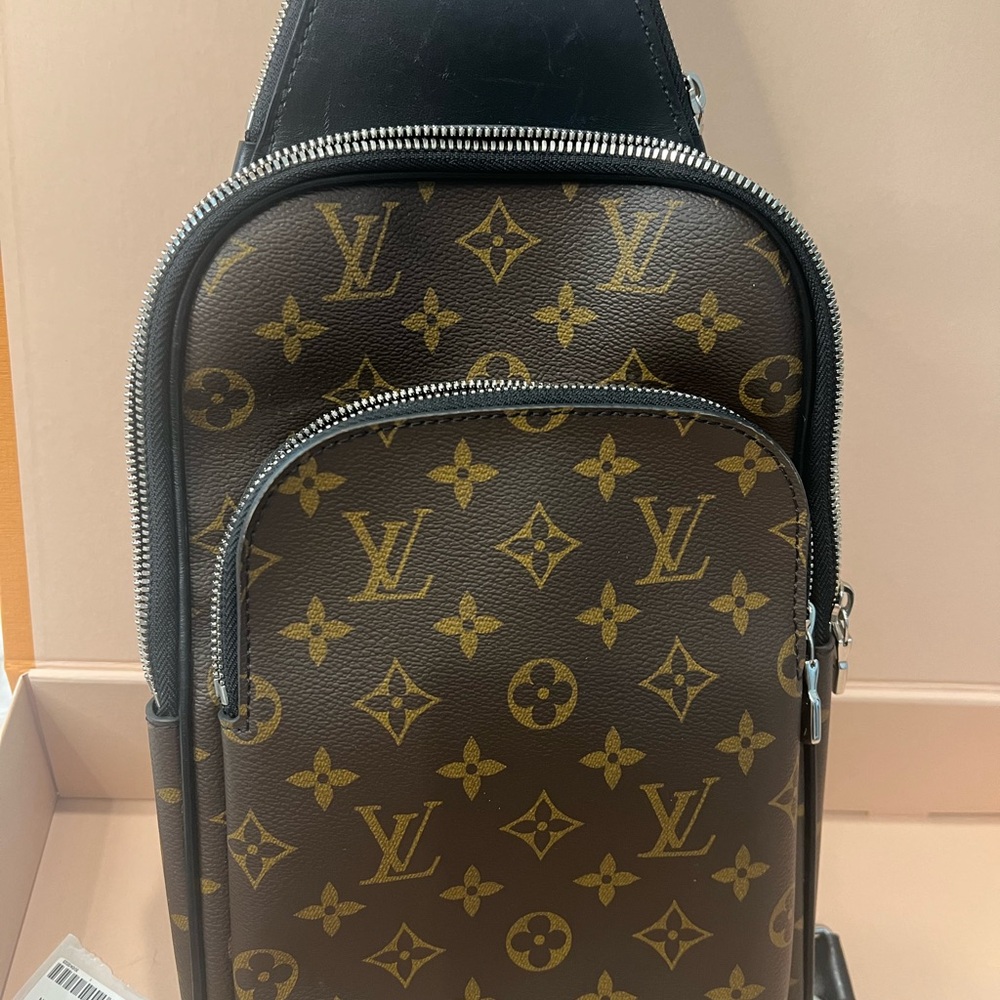 Louis Vuitton - sling back backpack!  Less than one year old!